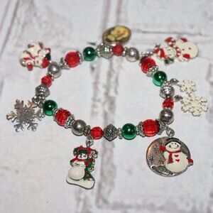 Beautiful silver, red and green winter/ snow man themed charm bracelet 7"
